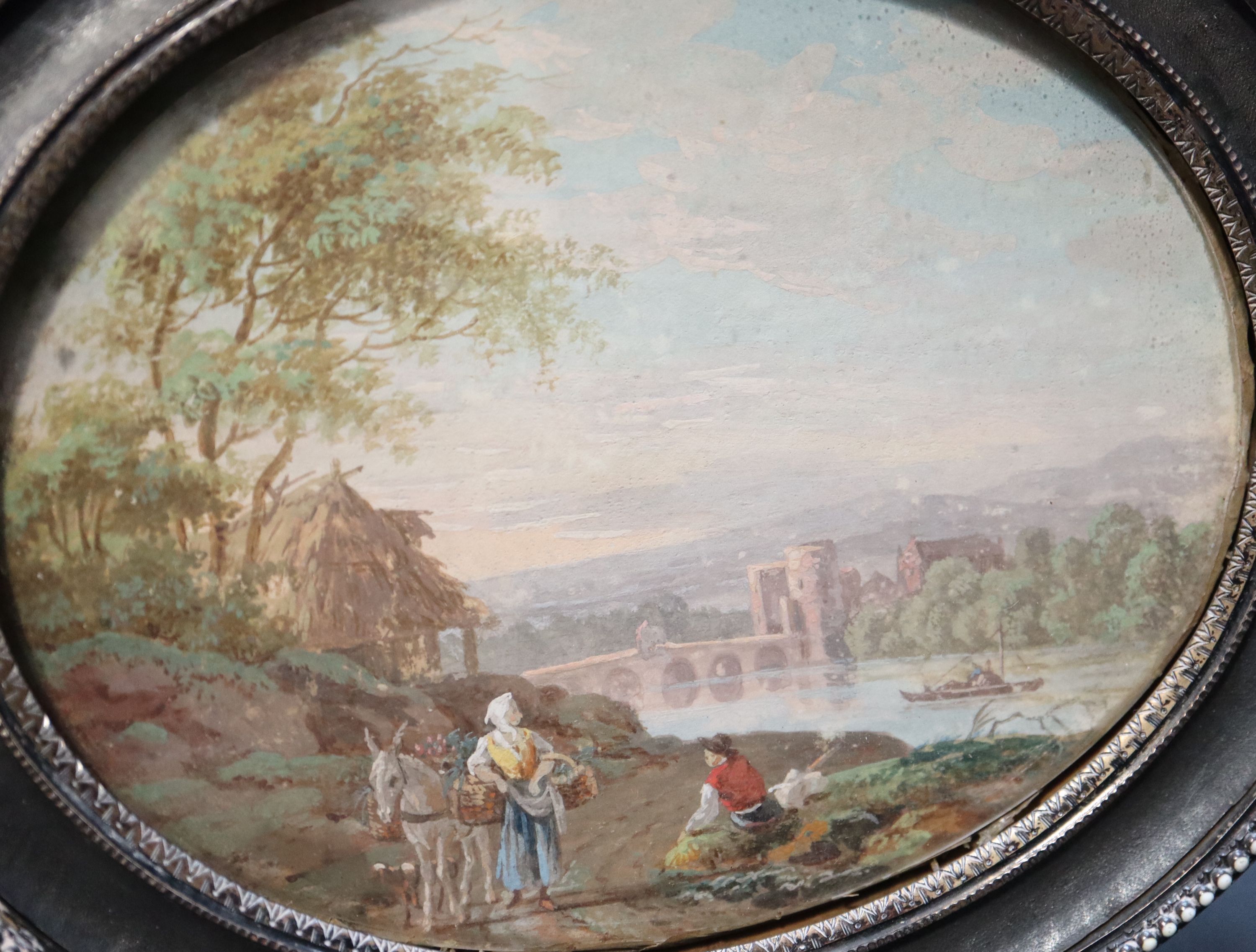 Style of Zuccarelli, Travellers in an Italianate landscape 9 x 11cm white enamel beaded decoration and gilt metal back overall 12.5 x 1